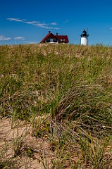Race Point Lighthouse Over Hill of Beachgrass on Cape Cod